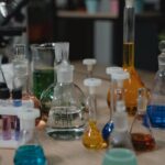Inorganic Chemistry illustration featuring the periodic table, chemical elements, and coordination compounds.
