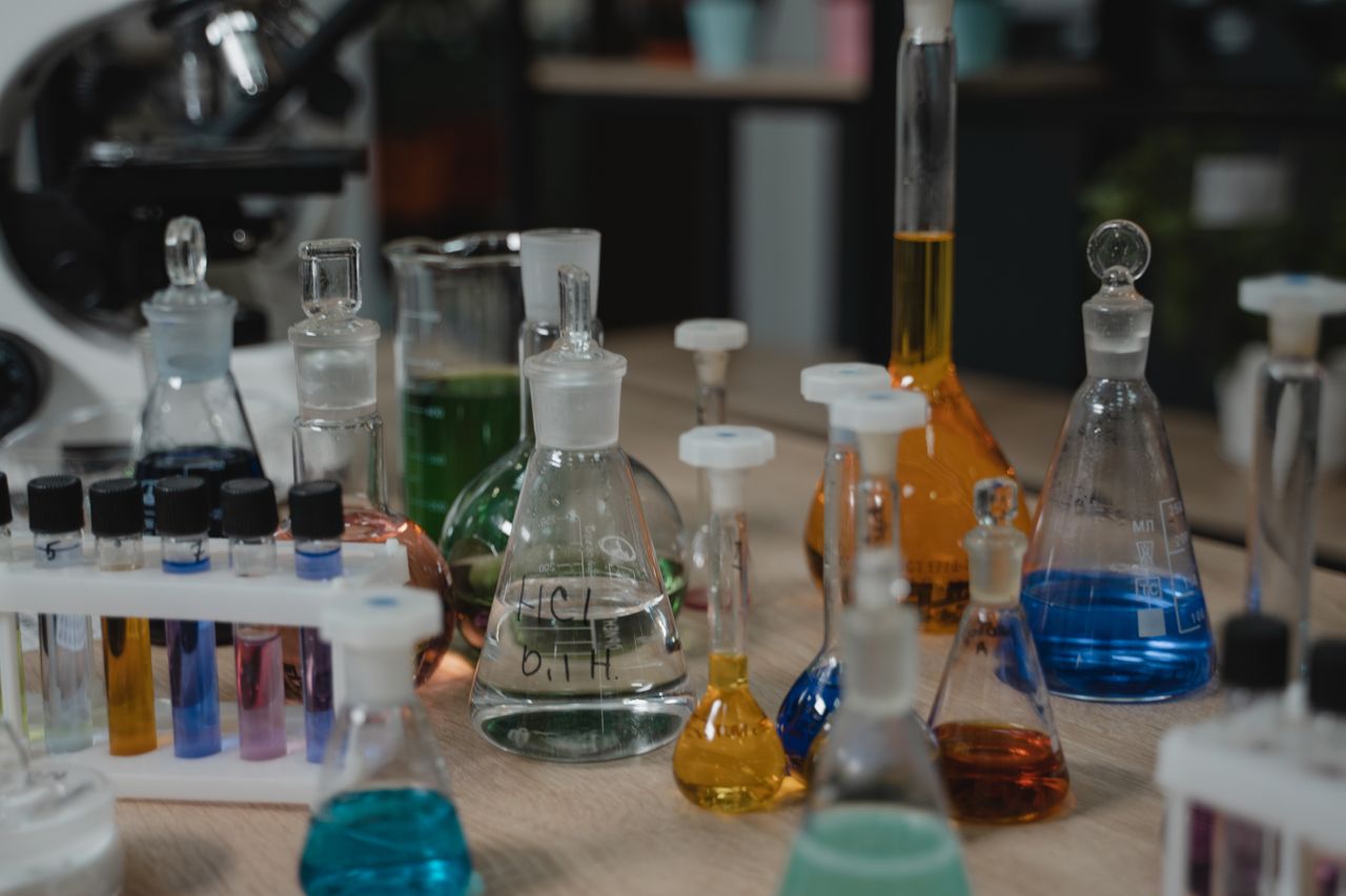 Inorganic Chemistry illustration featuring the periodic table, chemical elements, and coordination compounds.